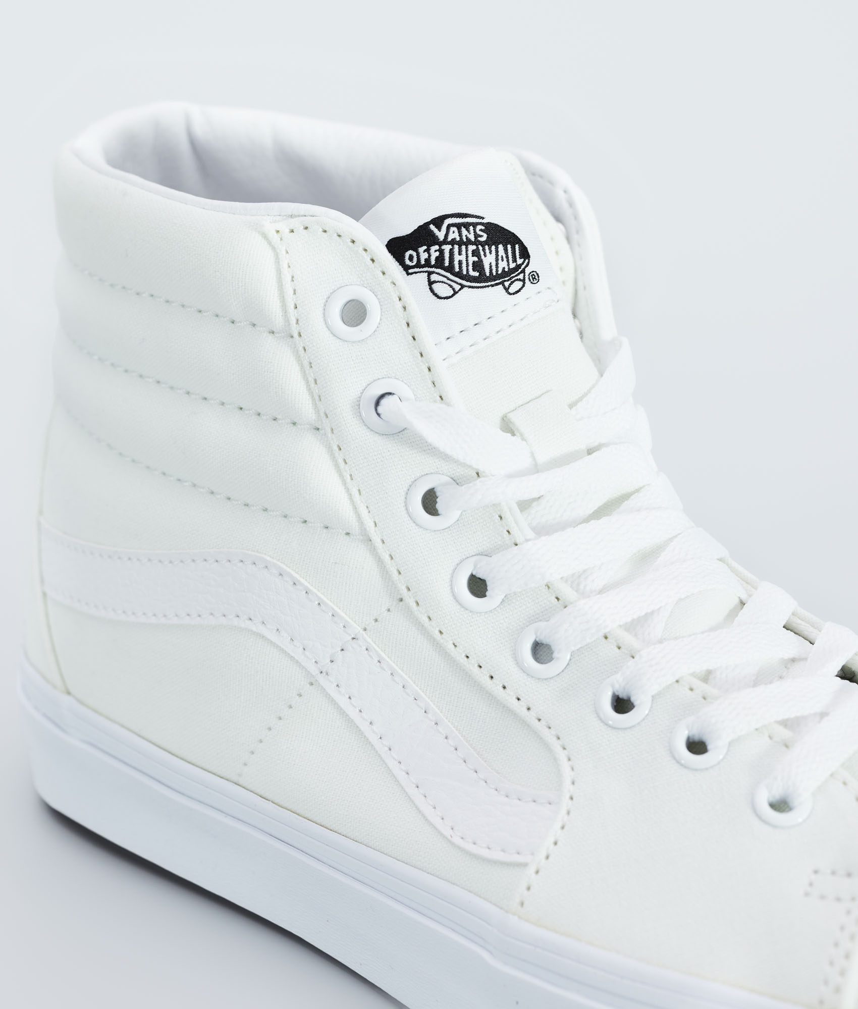 solid white high top vans