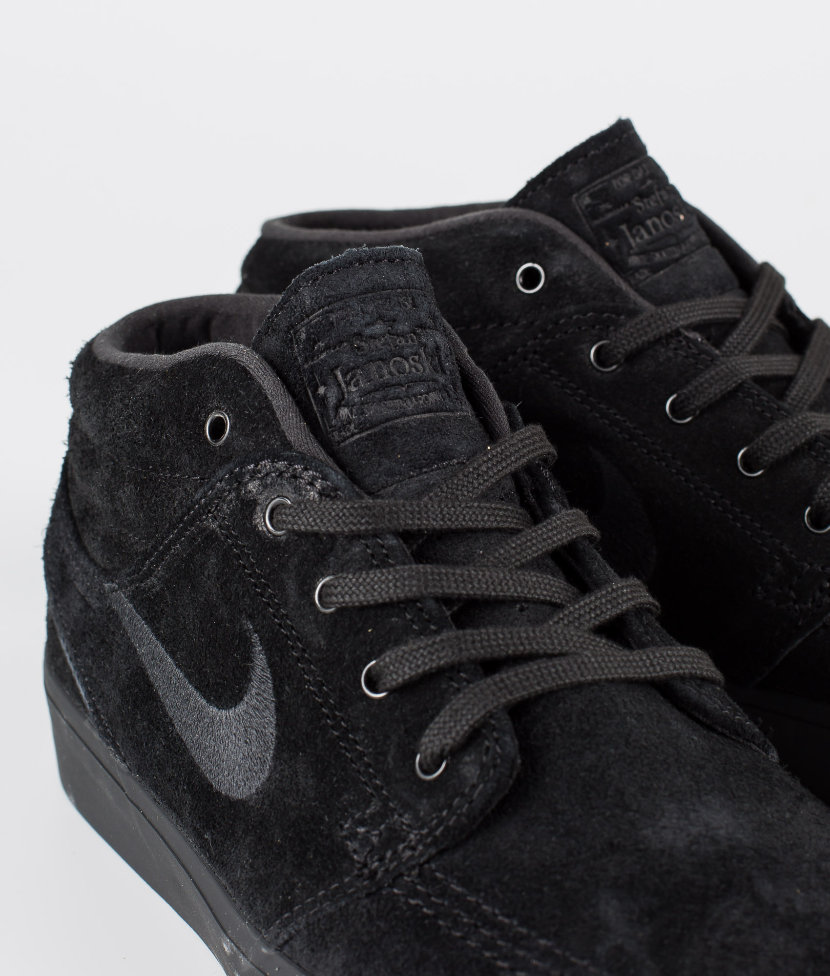 nike janoski black mid