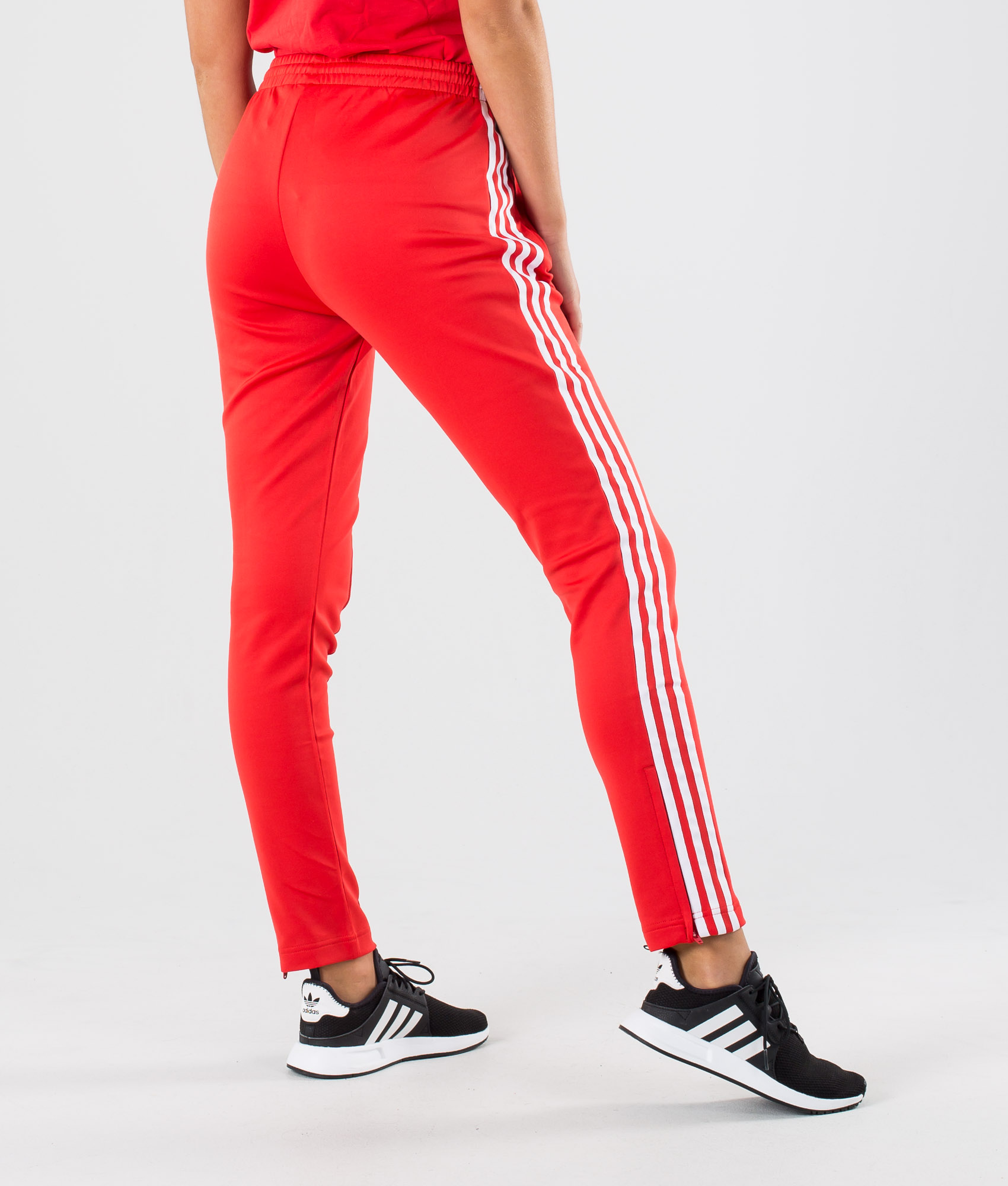 red and white adidas track pants