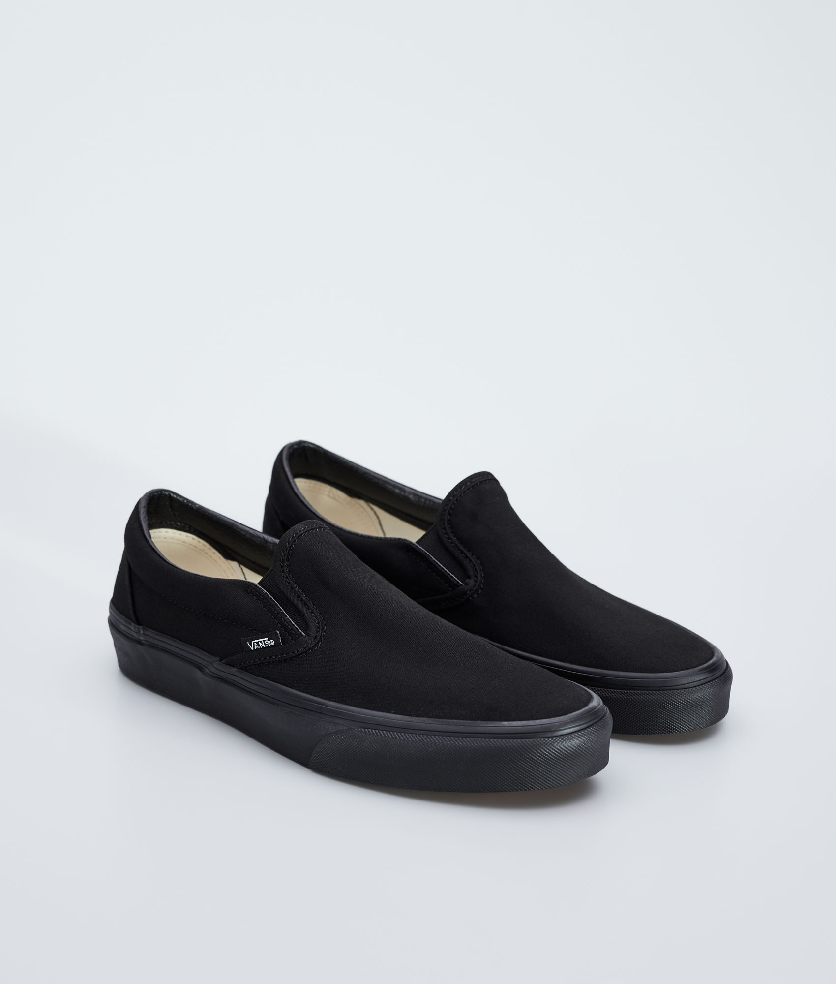 slip on full black vans