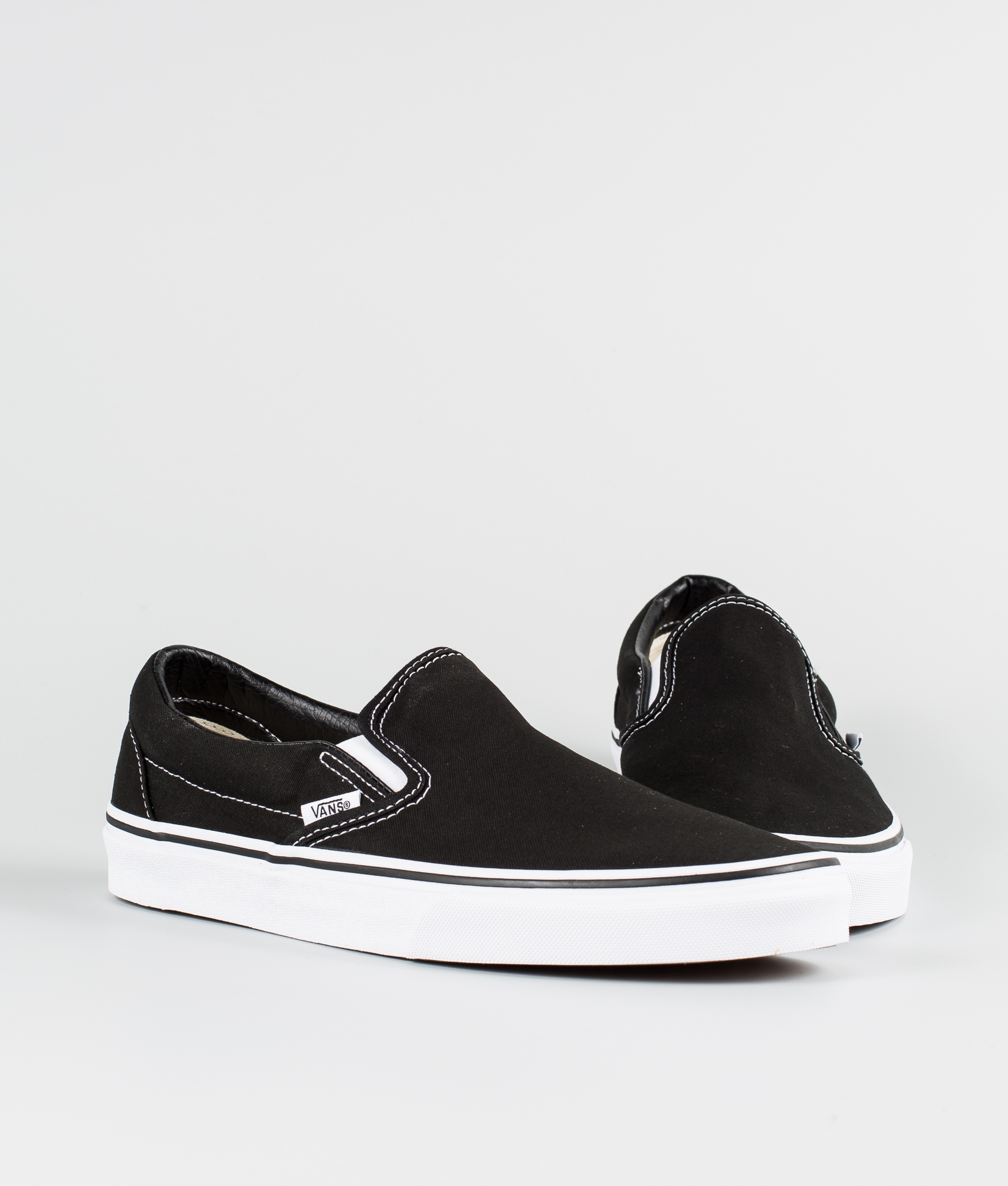 vans classic slip on black monochromatic shoes