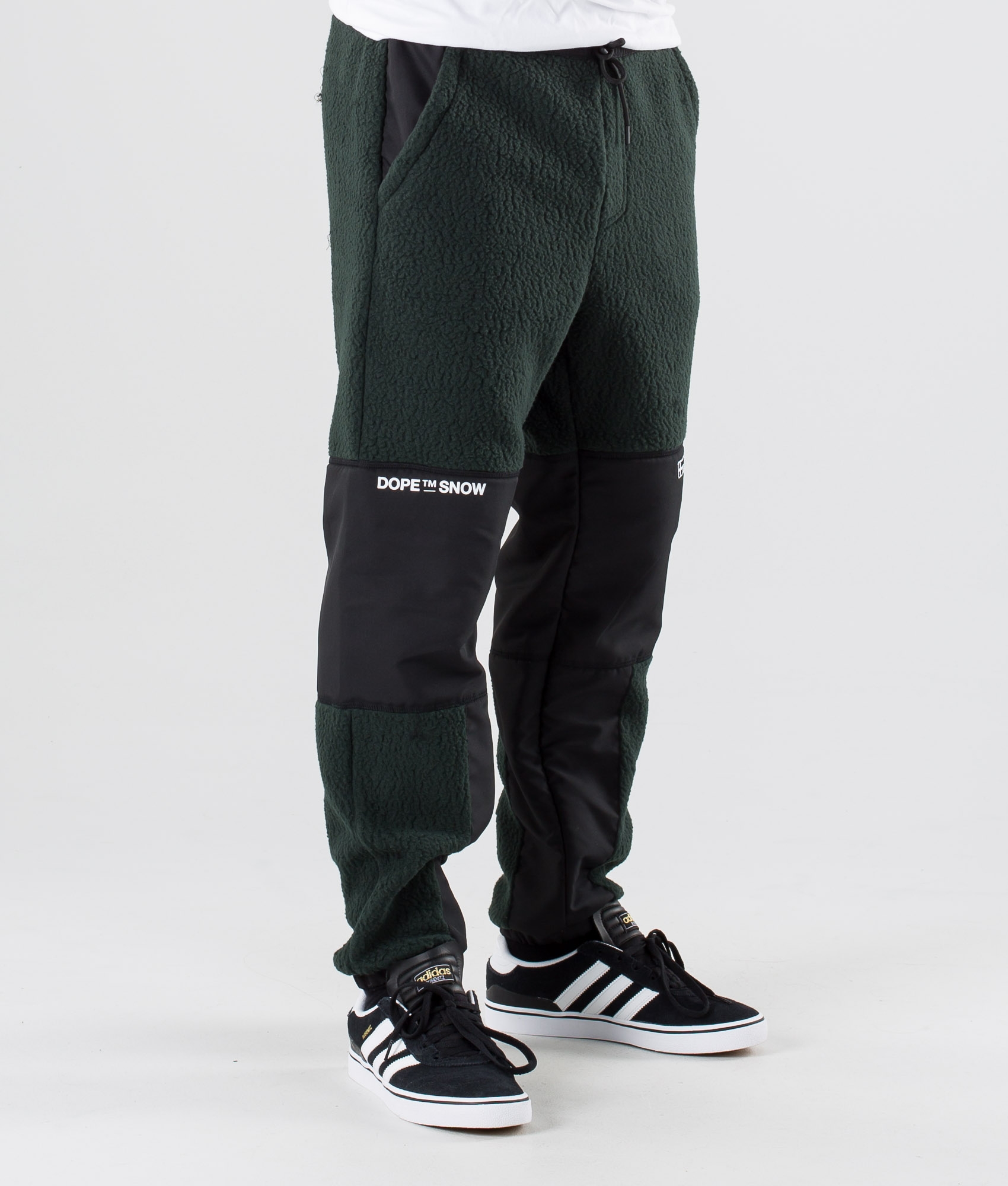 green and black adidas pants