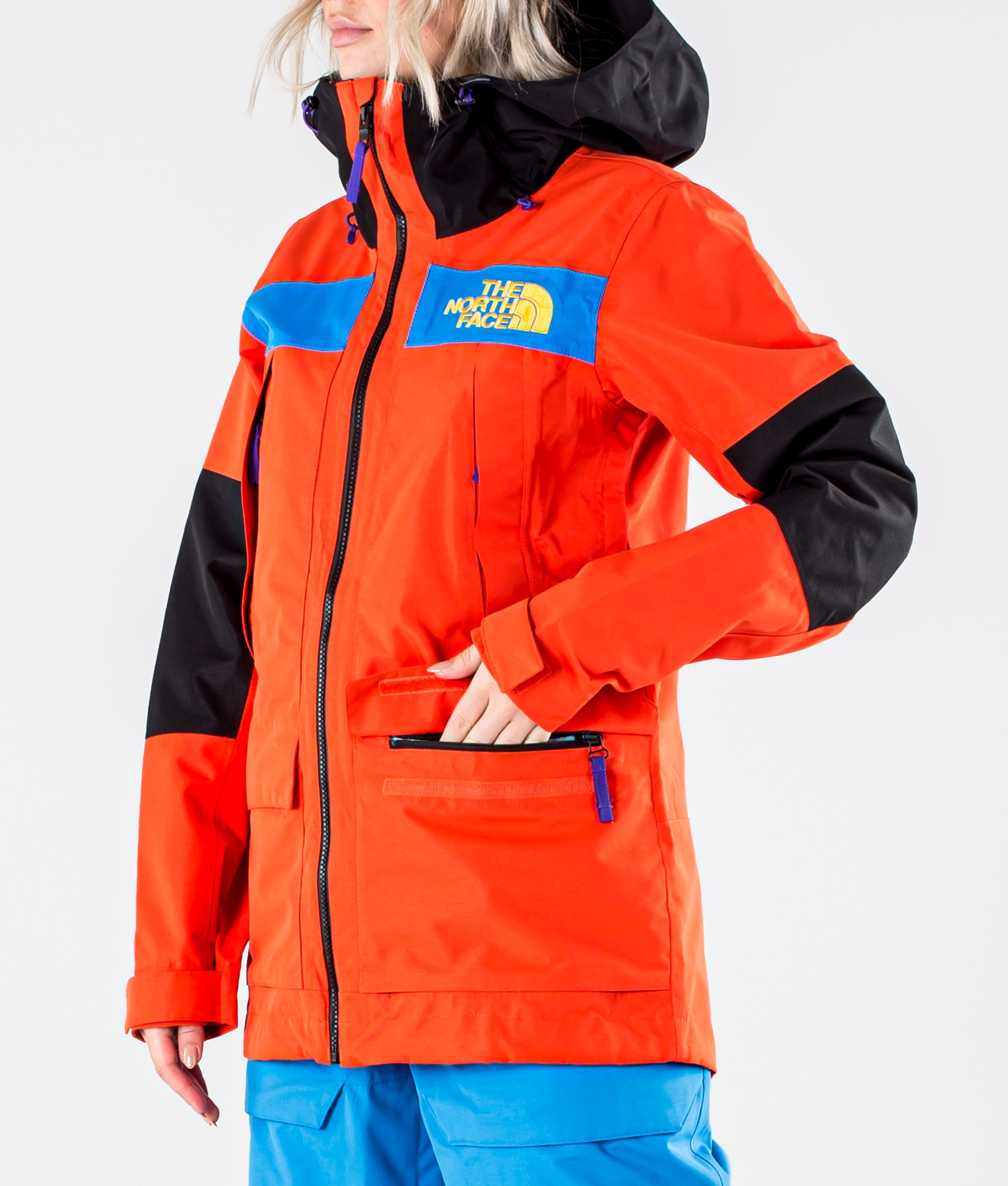 green and orange north face jacket